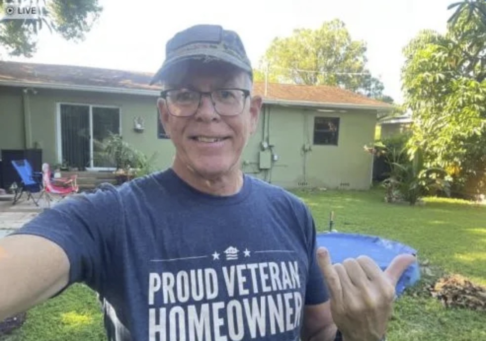 picture of Tim R. in front of a house